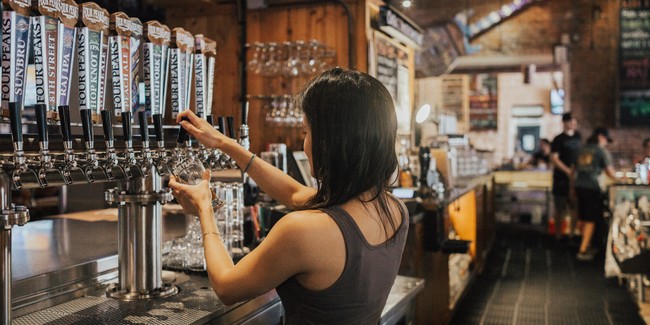woman-standing-facing-soda-dispenser-1267256.jpg